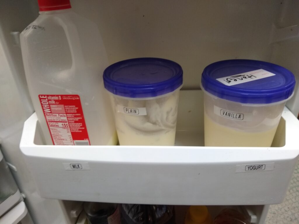 Yogurt in the fridge door bin