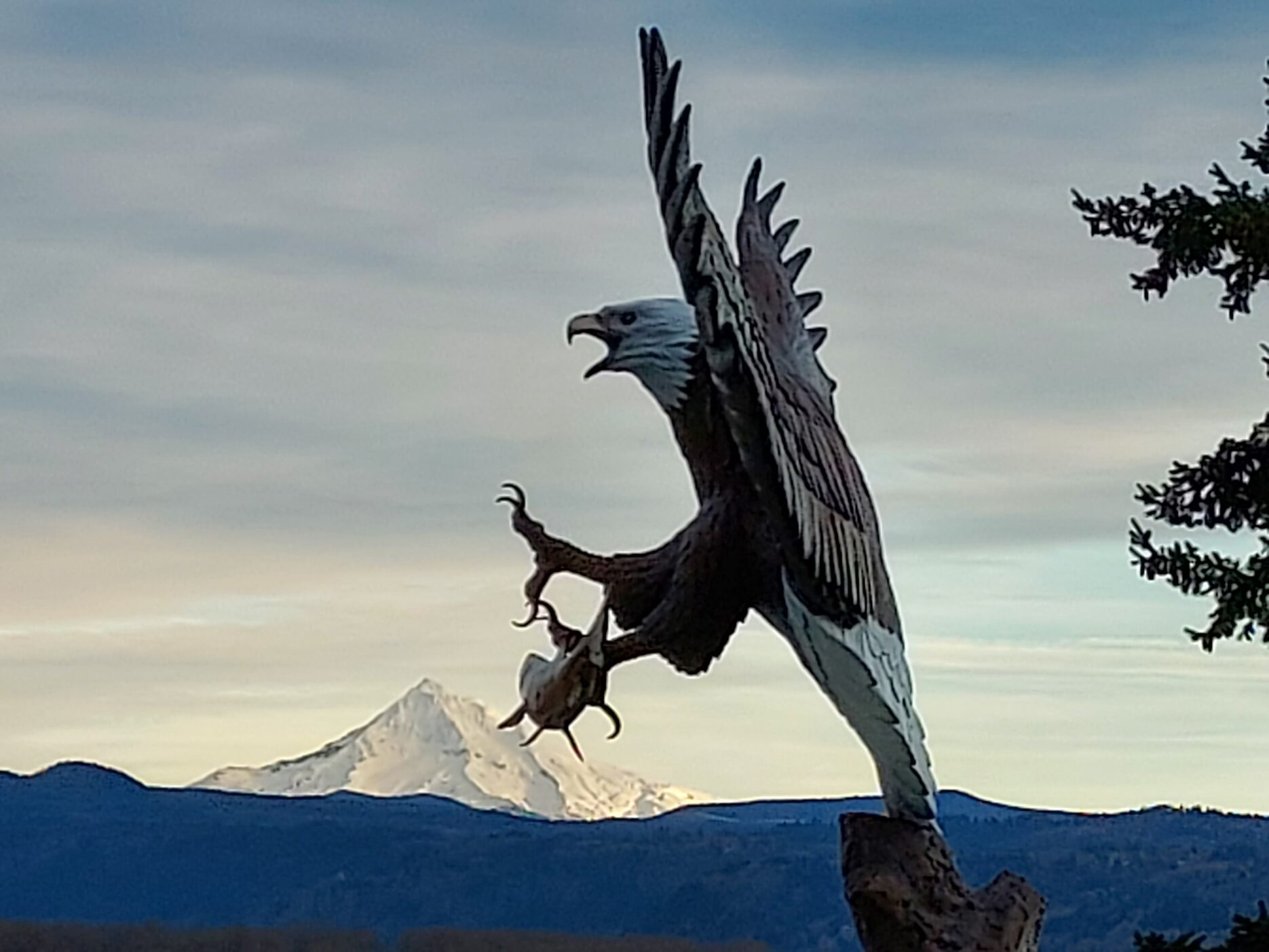 Eagle statue in front of Mount Hood